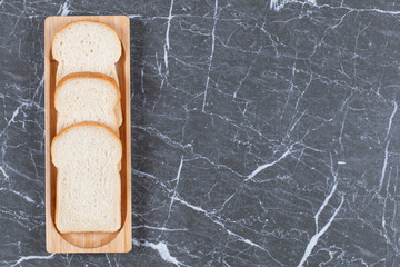 Sliced toast bread on the bread, on the marble background