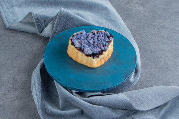 A blue plate with sweet heart shaped pastry