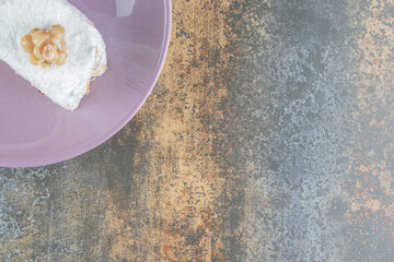 A purple plate of delicious cake with caramel