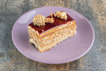 A purple plate of delicious cake with caramel