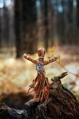 magic witchcraft doll made of tree bast in forest natural background. Forest grandmother, defender...