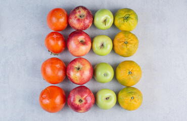 Seasonal fruits. persimmon apple and tangerines