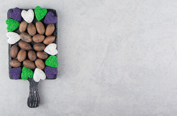 Nuts and cookie on the tray, on the marble background