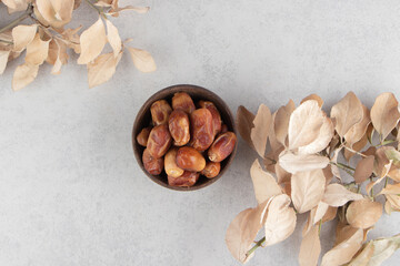 Toothsome dried fruit and leaves , on the blue background