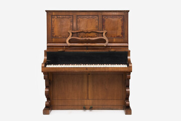 Fototapeta na wymiar Antique upright piano isolated on white background.