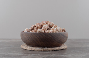 A bowl of confectionery on the marble background