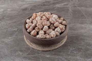 A bowl of confectionery on the marble background