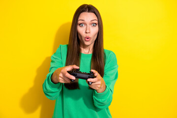 Photo of impressed person arms hold controller pouted lips play games isolated on yellow color background © deagreez
