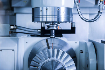 CNC machine. Metalworking heavy industry. High-tech and high-speed metal processing.