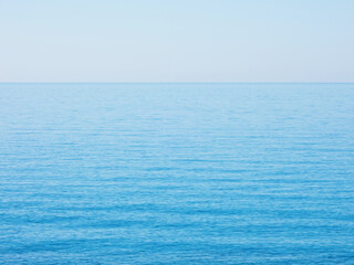 Obraz premium The blue water of mediterranean sea on a quiet sunny day