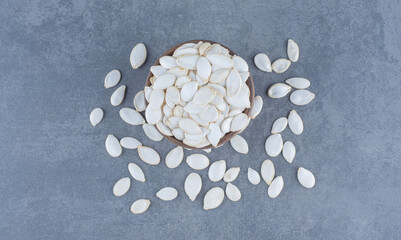 Fototapeta na wymiar Delicious seeds in the bowl , on the marble background
