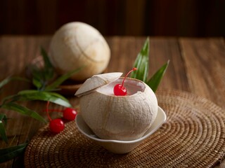 Coconut Pudding with raspberry served in a dish isolated on table side view