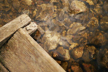 Clear water surface. Rocks underwater. Environmental protection 