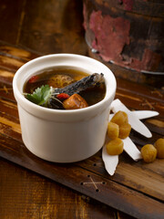 Dried Scallop with Black Chicken Soup served in a bowl isolated on table side view