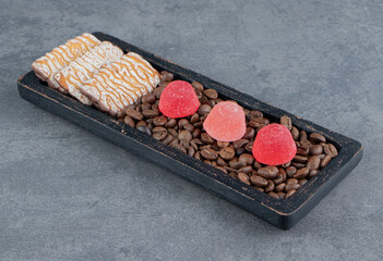 Sweet cookies with red jelly candies and coffee beans