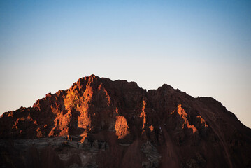 Fototapeta na wymiar Sunset in the mountains, high rocks on the sunset.