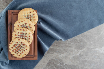 Fototapeta premium Homemade cookies stuffed with chocolate on wooden board