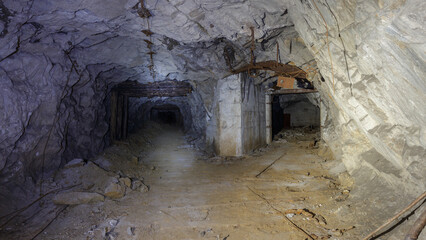 Fototapeta na wymiar Dark tunnel of old closed mine.