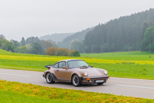 1986 Porsche 911 930 Turbo german oldtimer vintage luxury sports car in a picturesque landscape