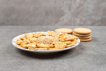 Various delicious biscuits on white plate