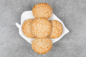 Biscuits with sesame seeds on white plate