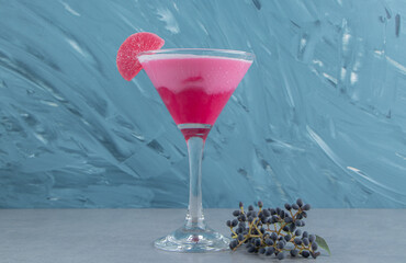 Grape and strawberry milk shake on the blue background