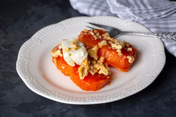 Traditional Turkish Pumpkin Dessert with Cream Butter (Turkish name; Kaymakli bal kabagi tatlisi or kabak tatlisi)