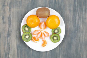 Sliced various fruits on a wooden table