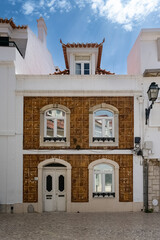 Cascais, small city in Portugal, typical street with flower houses
