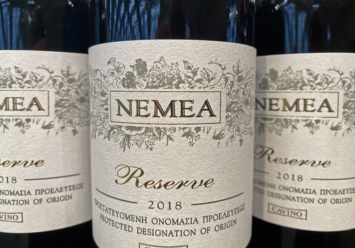 Viersen, Germany - Juin 9. 2022: Closeup of greek red wine bottles from winegrowing region Nemea in store shelf