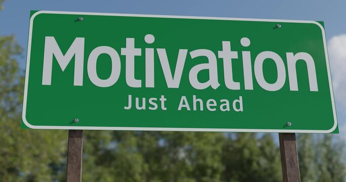 4k Drive By Pan of Motivation Just Ahead Green Road Sign.