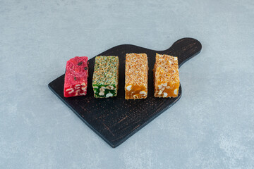 assorted pieces of turkish delight on the marble background