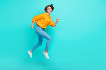 Fototapeta na wymiar Full length photo of carefree cheerful lady stylish comfort clothes big black friday sale empty space isolated on cyan color background