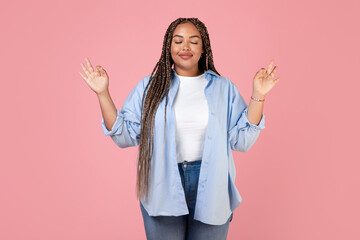 Peaceful Black Plus Size Lady Meditating Closing Eyes, Pink Background