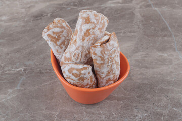 Pryanik cookies in a small bowl on marble background