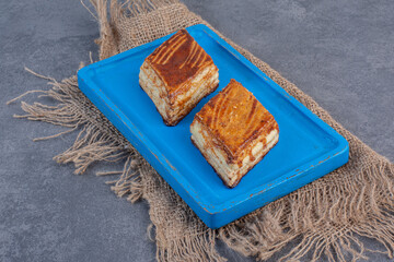 Homemade crispy pastries on blue plate