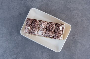 Slice of homemade cake on white plate