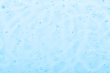 Cosmetic gel close-up with oxygen bubbles. Textured background with microbrushes in cosmetics. Moisturizing skin serum with vitamins and collagen.