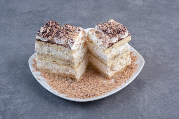 Two slices of homemade cake on white plate