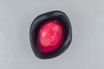 Fresh red nectarine in black bowl