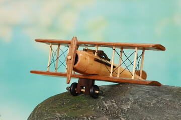 Wooden model of the aircraft with two wings and propeller