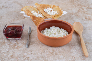 Roll pancakes with cottage cheese and milk