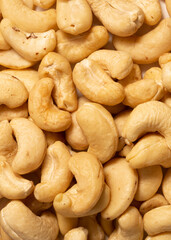 Cashew nuts as a background, top view. Cashew isolated on white background. Healthy foods.