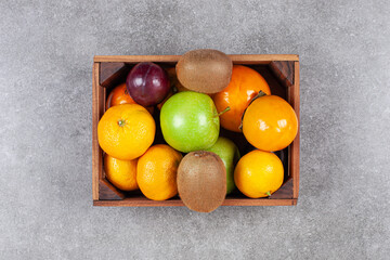 Various sweet fresh fruits on a wooden basket