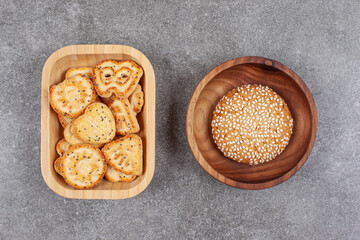 Various shaped biscuits and cookie on marble surface
