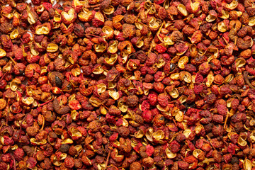 Sichuan hoju pepper. Pepper close-up as a background. Spices of China, Tibet, Japanese pepper Huajiao. Seasoning for dishes. Additive for the preparation of delicious delicacies. Sauces set.