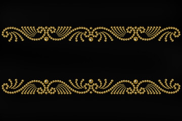 black background with patterned border of golden pearl beads and copy space