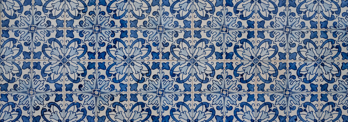 Azulejos in Portugal, detail on a typical house, colorful background
