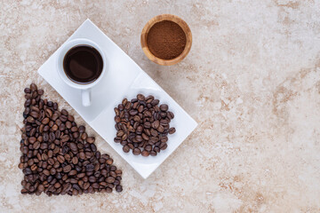Various forms of coffee arranged on marble background