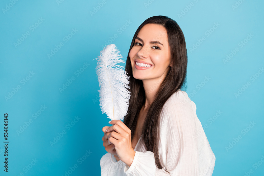 Sticker photo of pretty brunette lady hold feather wear white blouse isolated on blue color background